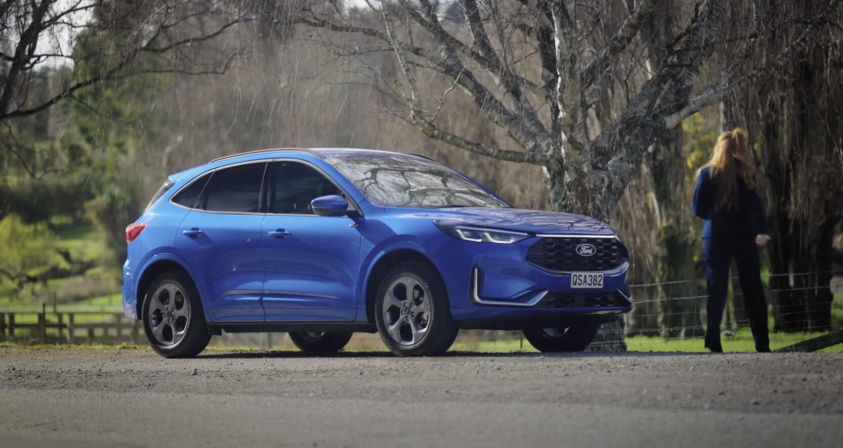 Professional Vehicle Transport - Flatbed Towing Service Modern vehicle being prepared for safe transport - Professional towing service